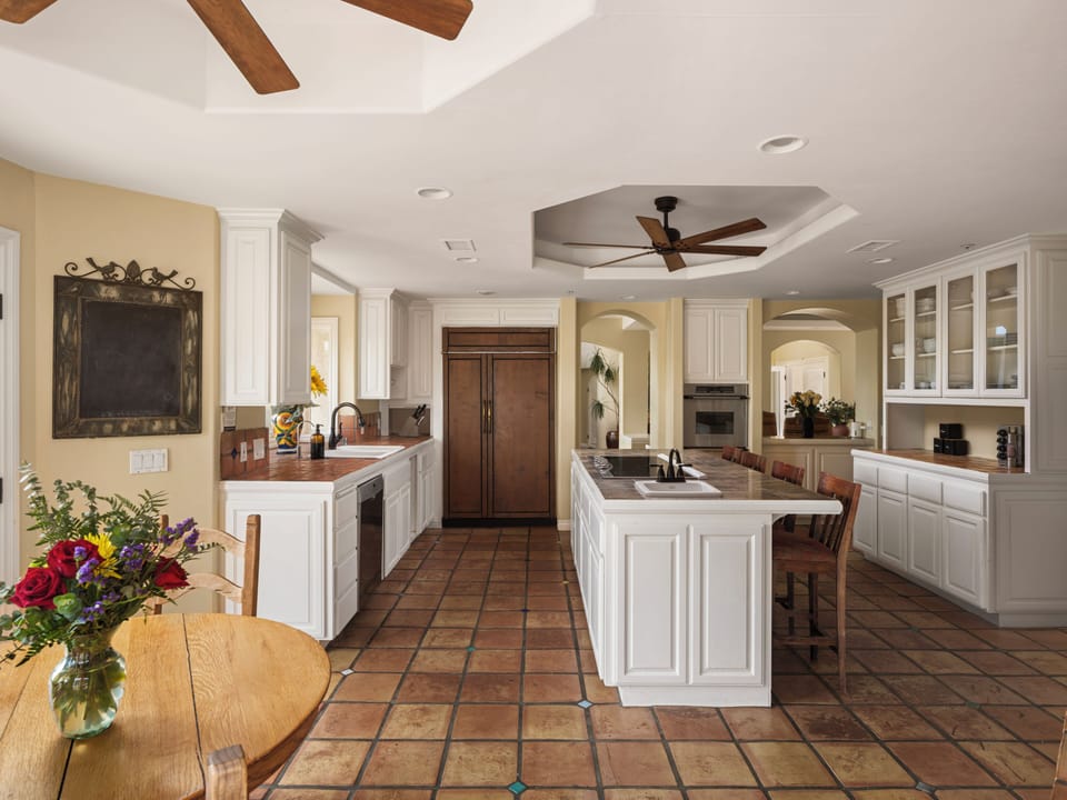 Spacious kitchen with modern appliances.