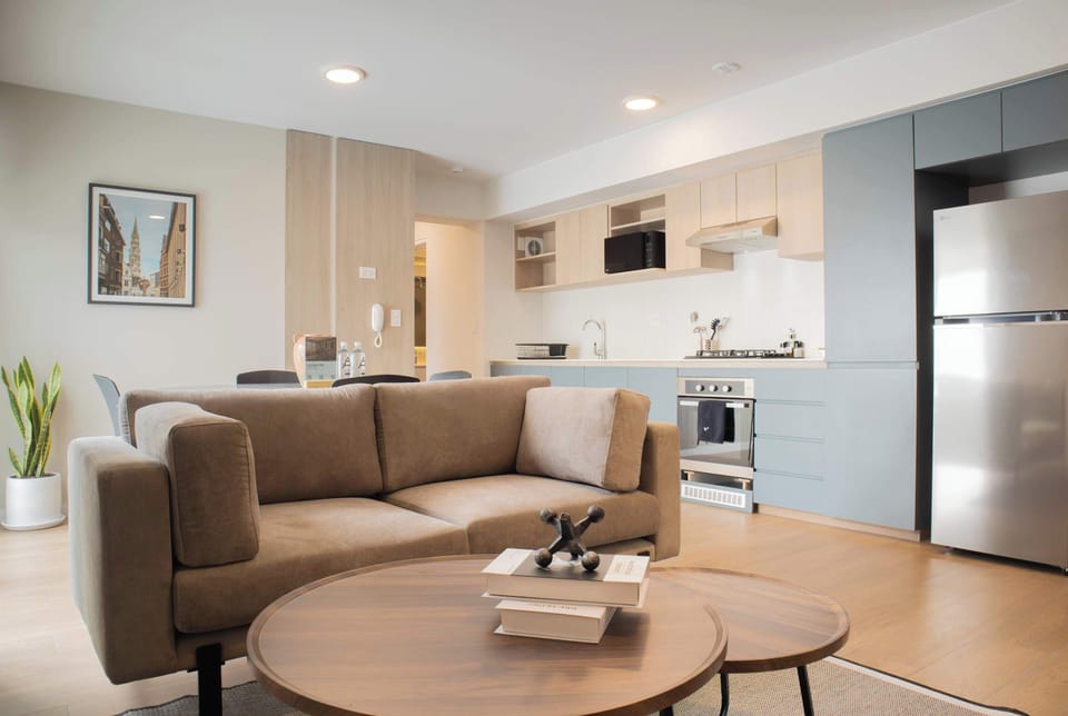 Open living and dining room with warm tones and cozy seating.