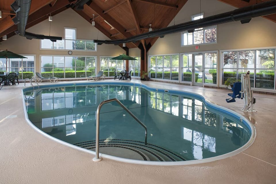 Swim in calm comfort beneath warm wood beams and skylights.
