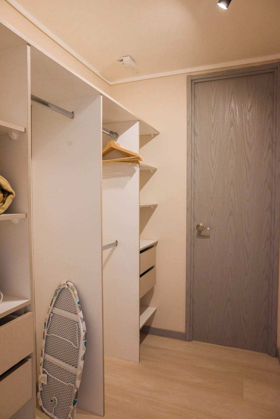 Spacious closet with ample storage and modern design, perfect for organizing your belongings during your stay.