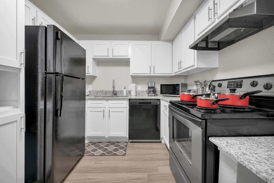 Stylish kitchen w/ modern finishes and plenty of prep space.