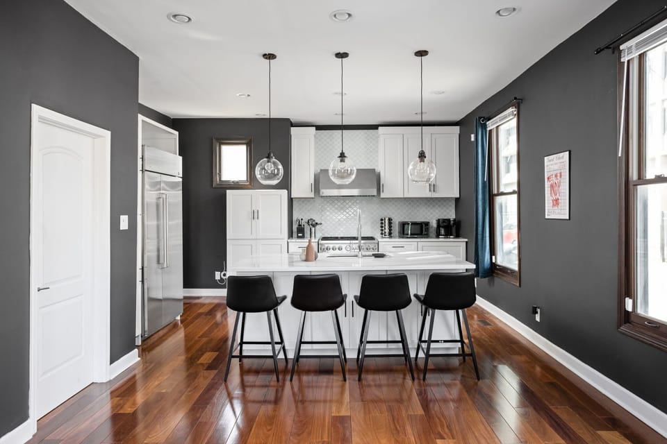 Sleek chef’s kitchen with modern finishes and a stylish breakfast bar