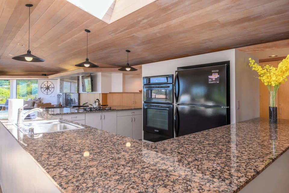 Cook with ease in the open kitchen, featuring modern appliances and ample space.