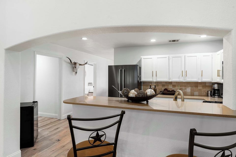 Bar seating connected to the kitchen for casual meals and conversation