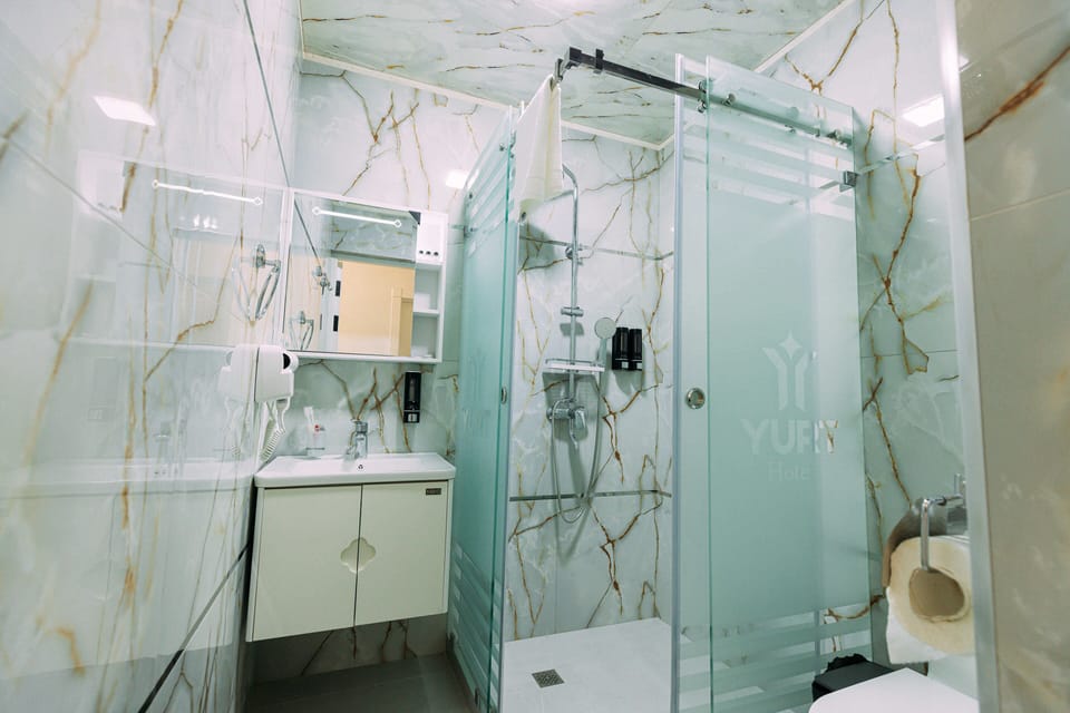 Shower, free toiletries, hair dryer, bathrobes