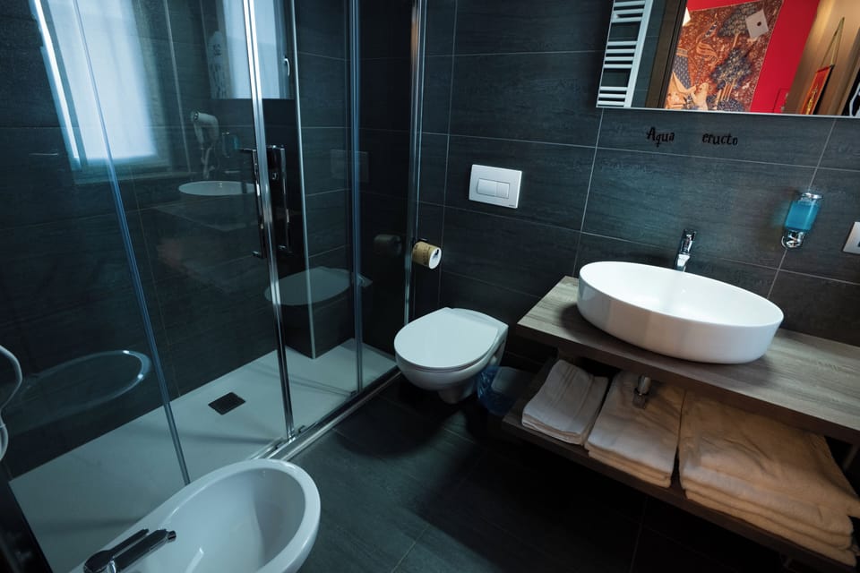 Family Quadruple Room | Bathroom | Shower, hair dryer, towels, soap