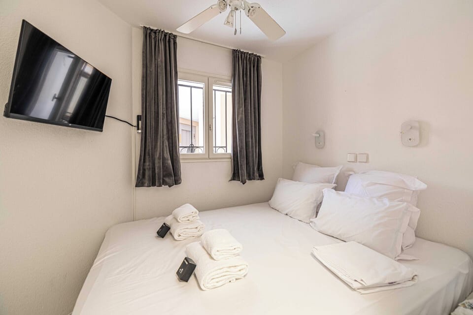 Apartment | Laptop workspace, iron/ironing board, bed sheets