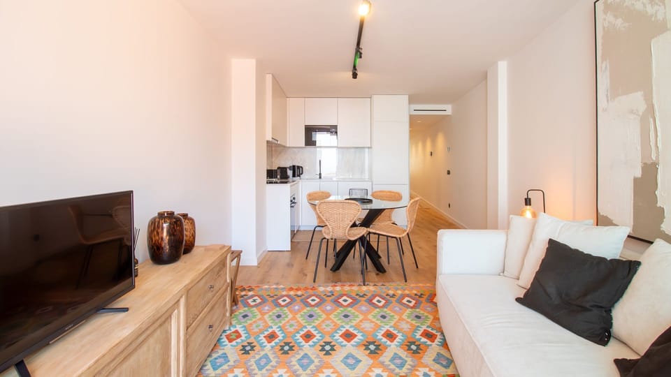 Style and function blend in this open-concept space. #ModernDesign #PortoApartments