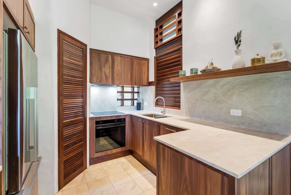 Prepare everything from beachside breakfasts to evening dinners in the well-equipped kitchen, where stone benchtops, quality appliances and thoughtful storage make holiday cooking effortless.