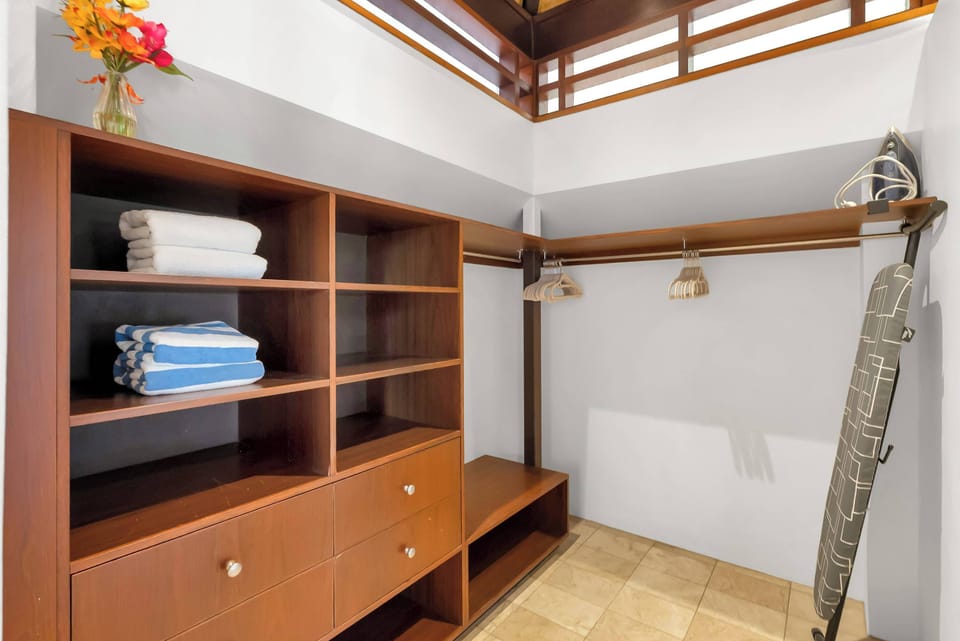 The spacious walk-in wardrobe provides ample room to unpack and settle in, helping longer stays feel comfortable and organised from the moment you arrive.