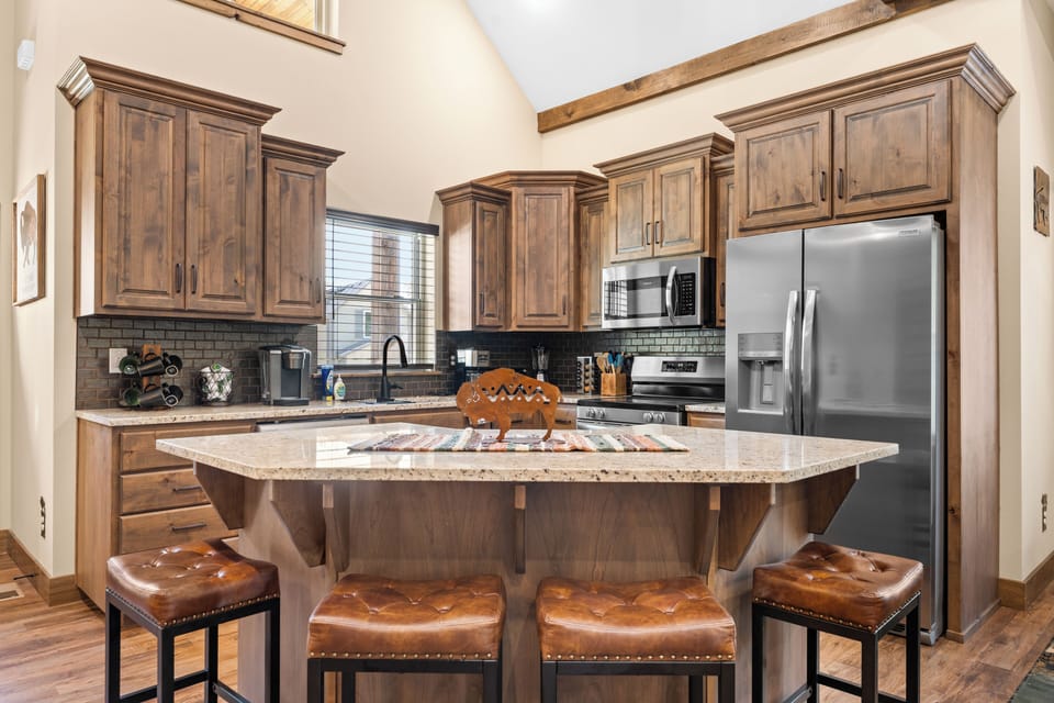 Stocked kitchen and sit up bar