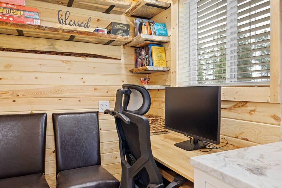 Stay productive during your trip with a dedicated workspace featuring a comfortable office chair, desk and a monitor for your convenience—perfect for remote work or catching up on emails