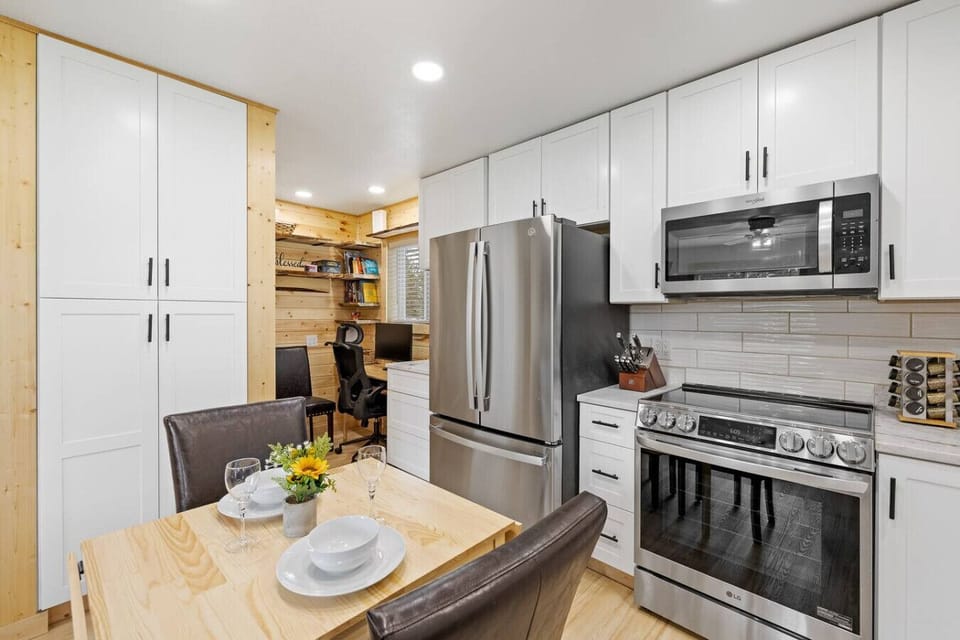 You’ll also find a dedicated workspace conveniently located in the kitchen area, perfect for catching up on emails or planning your next adventure while enjoying a cup of coffee.