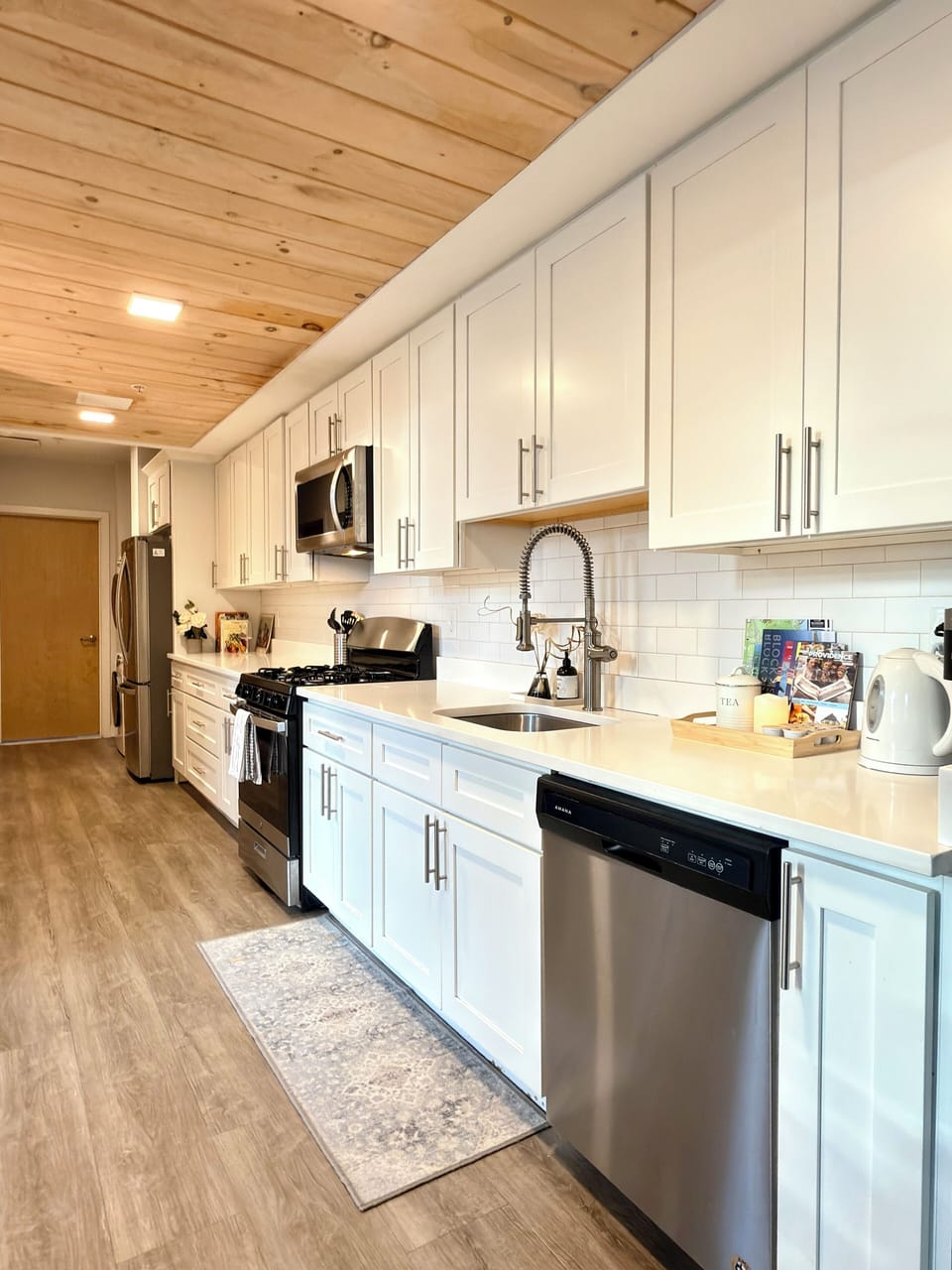Bright and clean kitchen, fully equipped for effortless home cooking.