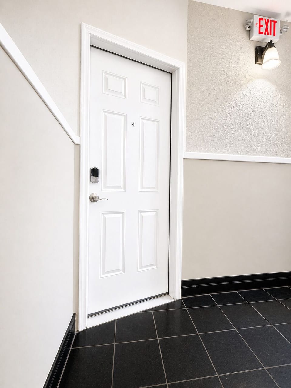Secure smart-lock entry in a bright, modern tiled hallway