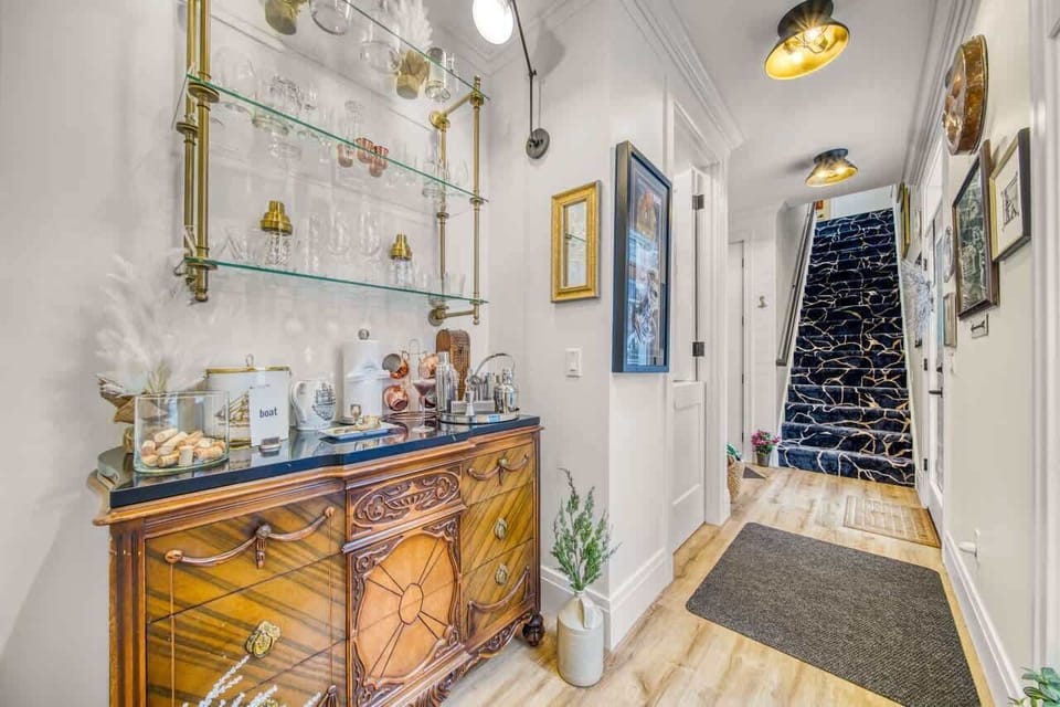 Bar area. Stairs go up to the billiards room, which has a balcony