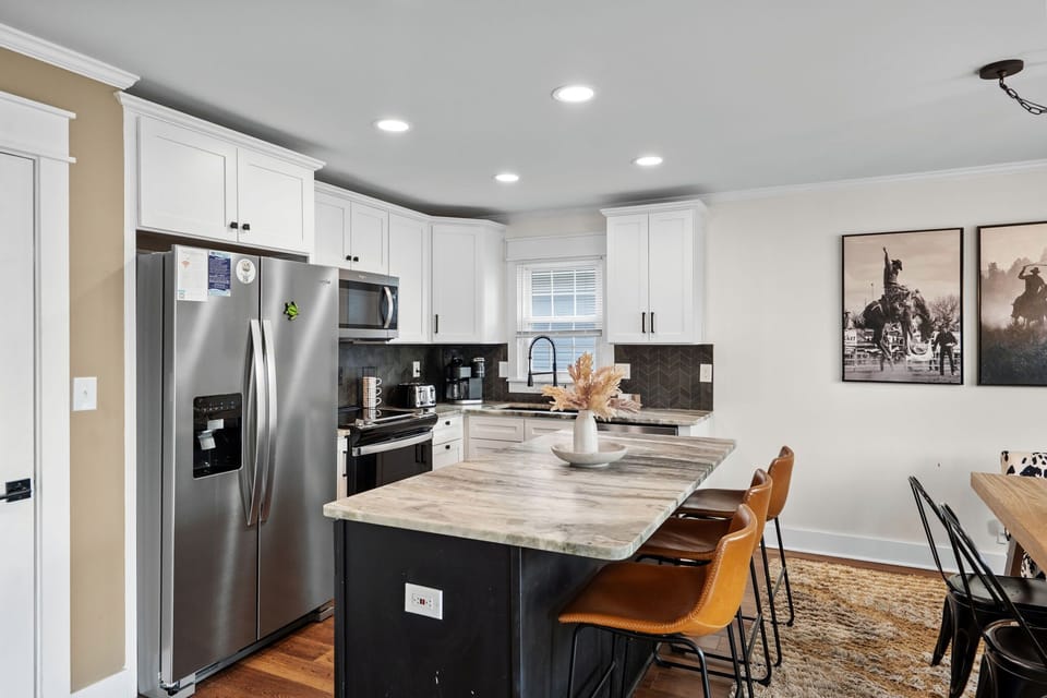 Kitchen area with island and seating.
