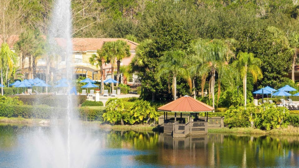 Take in lake views with a dancing fountain and palm-lined paths-follow the boardwalk to the gazebo and relax under the blue umbrellas!
