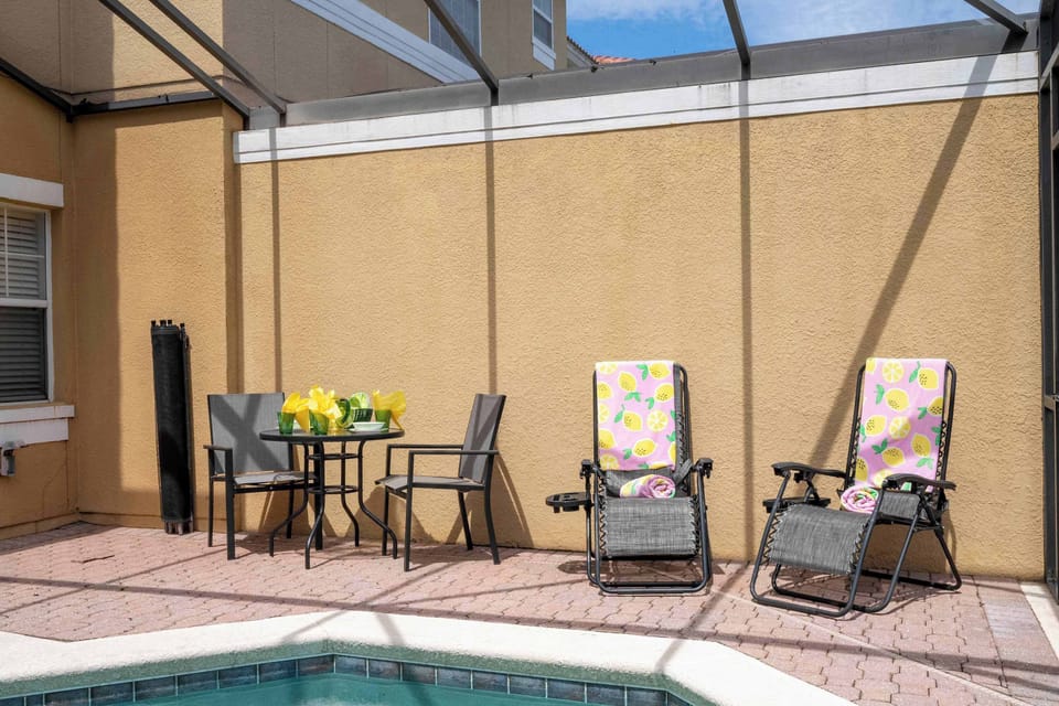 Soak up the sun on zero‑gravity loungers or sip at the bistro table beside the pool-your own secluded lanai oasis.