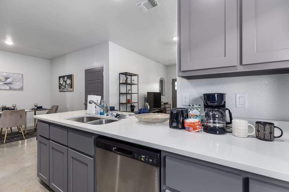 Kitchen: Sleek countertops meet modern appliances for delightful culinary adventures!