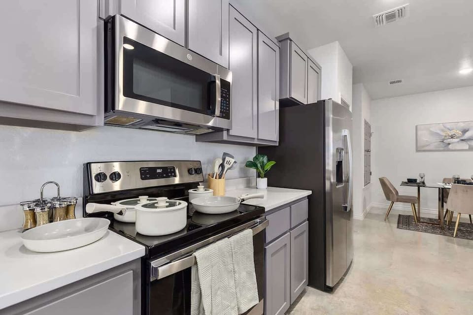 Gourmet Kitchen: Cook up a feast in this sleek space with modern appliances and chic decor!