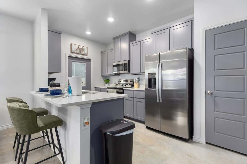 Kitchen Delight: Modern cabinetry and sleek appliances make culinary adventures a breeze!