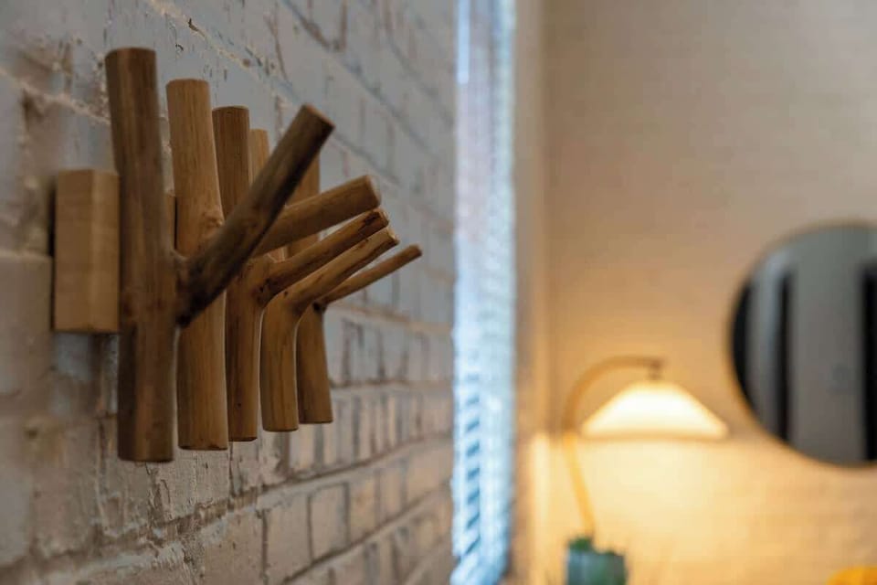 A decorative and functional item used for hanging clothes, hats, or other accessories, often adding both practicality and style to a space.