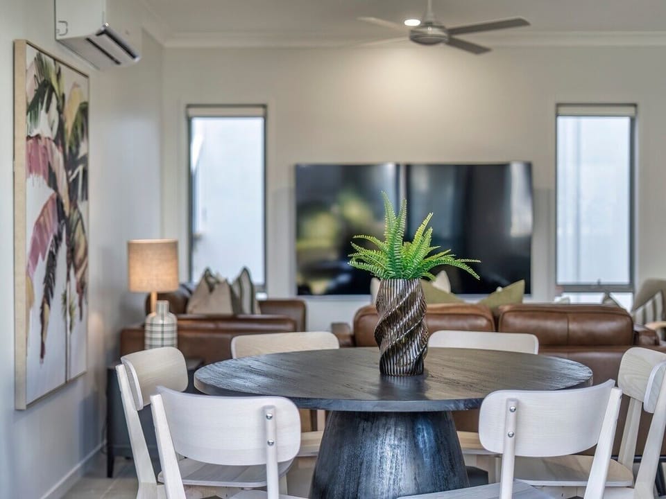 Kitchen-side dining with a six-seat table and practical breakfast bar.