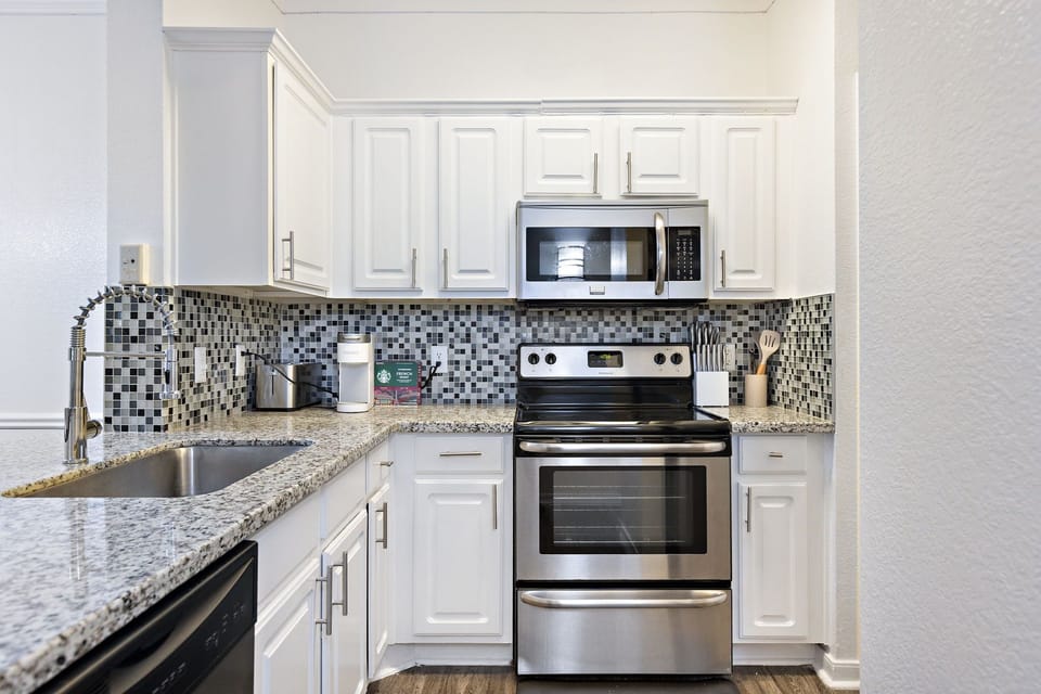 Enjoy a fully equipped kitchen featuring Keurig coffee maker