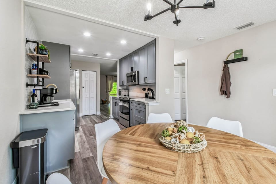Gather in the kitchen, fully stocked, including a coffee/tea bar.