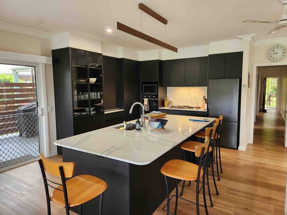 Fully equipped modern kitchen with large bench top and all your cooking needs