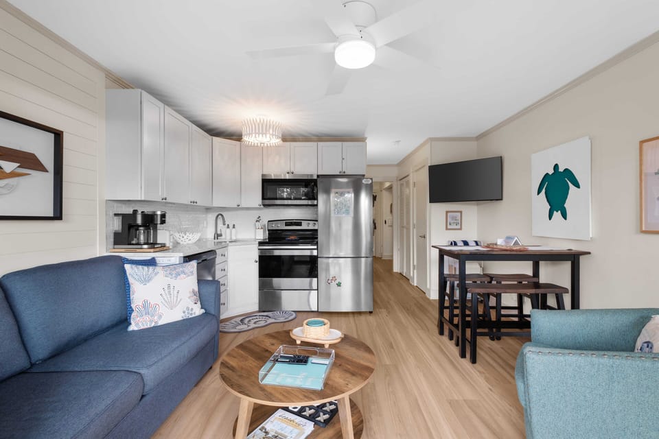 Beach theme living room with local art, shiplap and plenty of room for relaxing