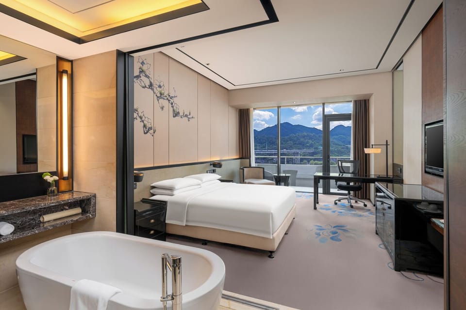 Superior Double Room | Minibar, in-room safe, blackout drapes, iron/ironing board