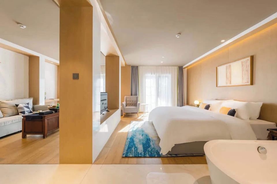Luxury Suite, City View | Desk, laptop workspace, blackout drapes, soundproofing