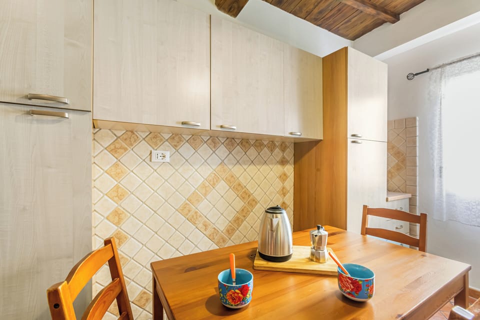 Fridge, electric kettle, toaster, cookware/dishes/utensils
