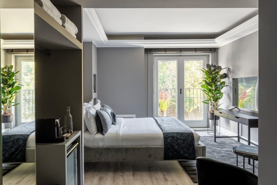 Superior Triple Room | Minibar, in-room safe, desk, laptop workspace