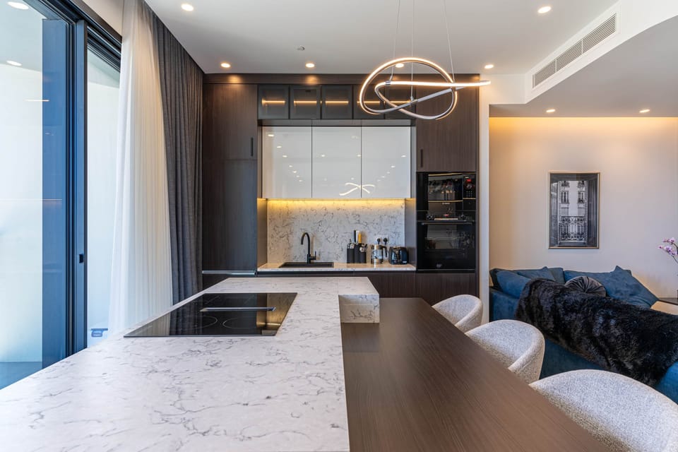 Open kitchen with bar style dinner table