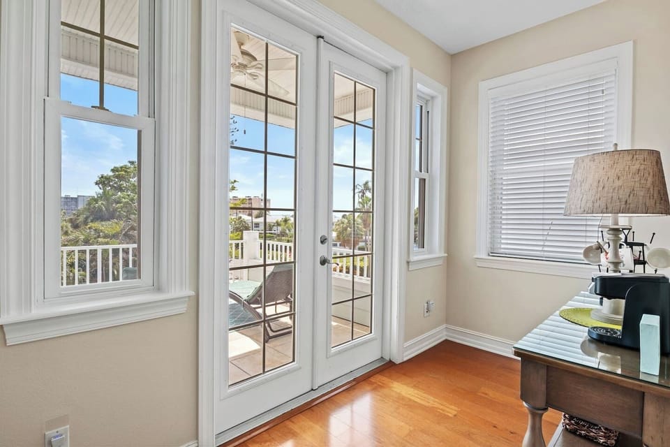 Doors to third floor balcony and coffee station located near Bedroom 3