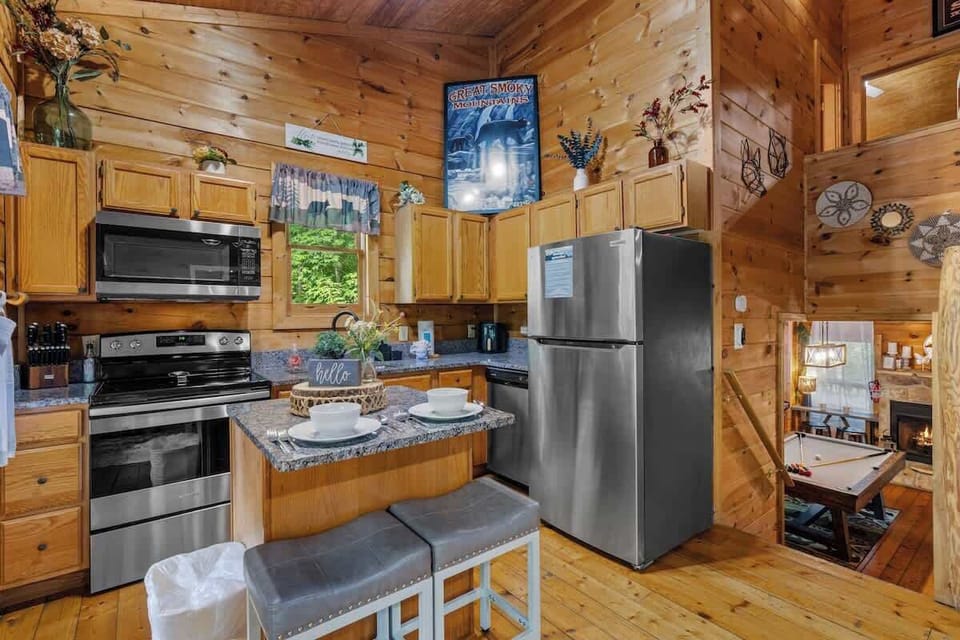 The well-stocked kitchen features granite countertops and stainless appliances.