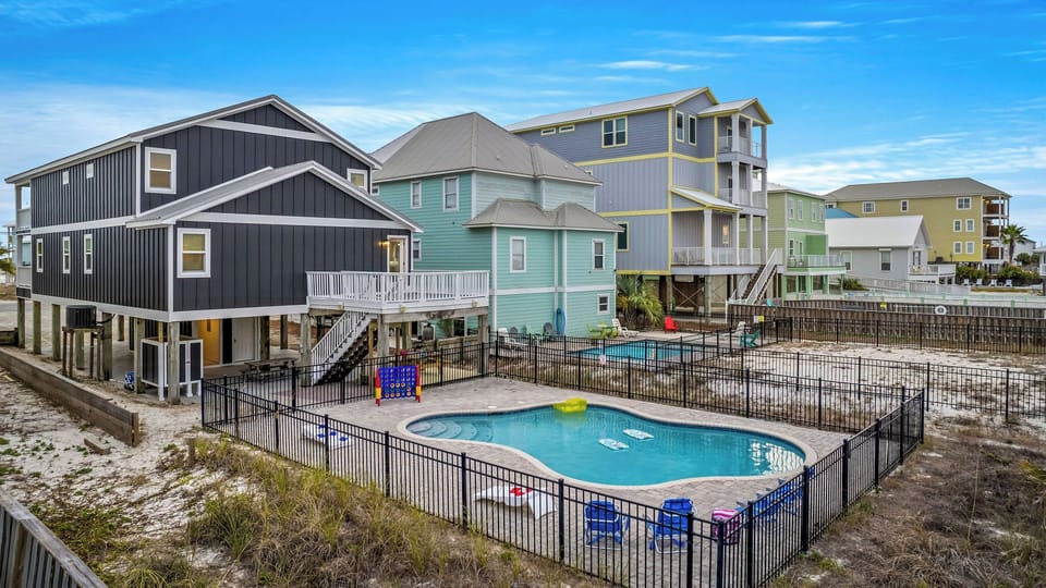 Relax by your private pool, steps from the beach your Gulf Shores escape!