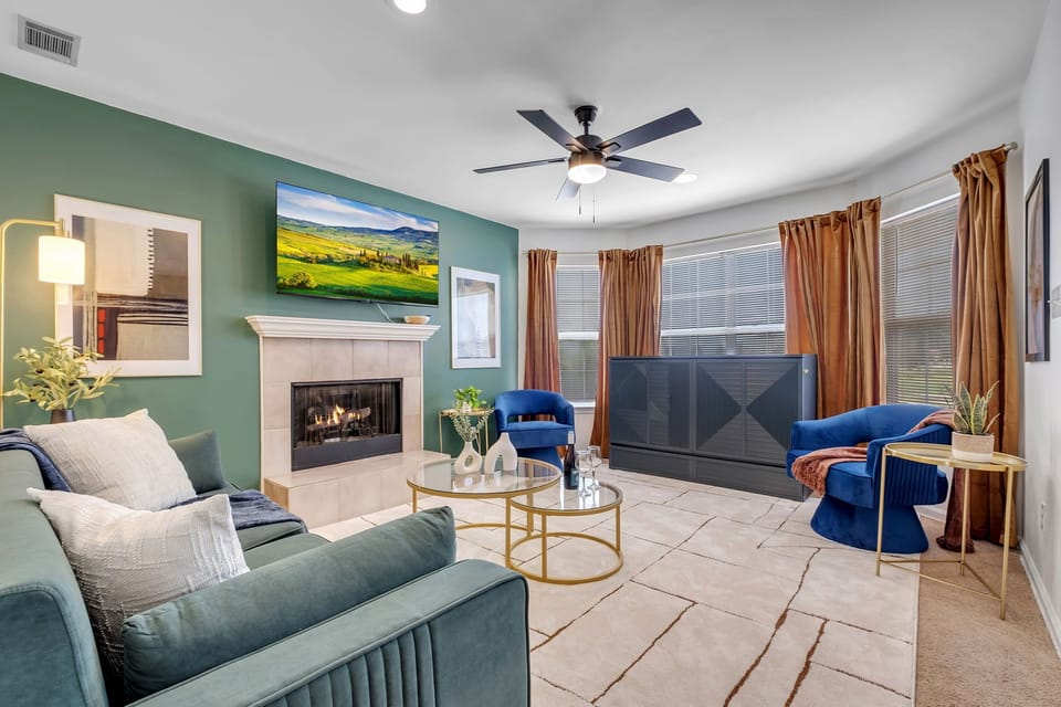 Whole room of the living room with ceiling fan, and TV