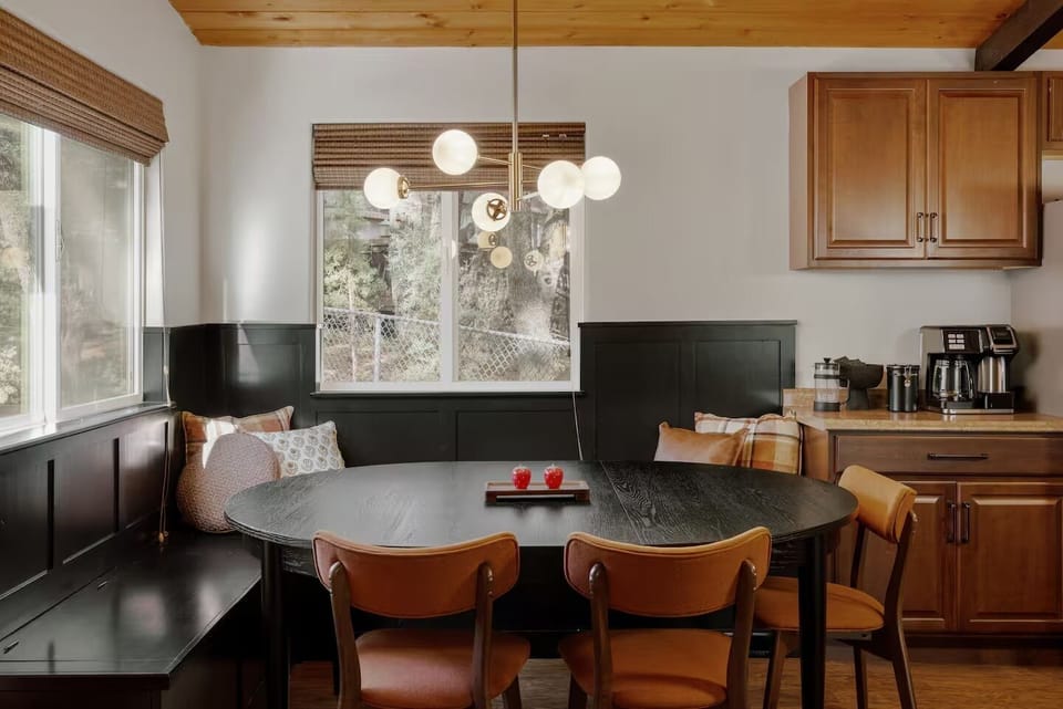 Dining area with dining bench is super cozy for meals and family games.