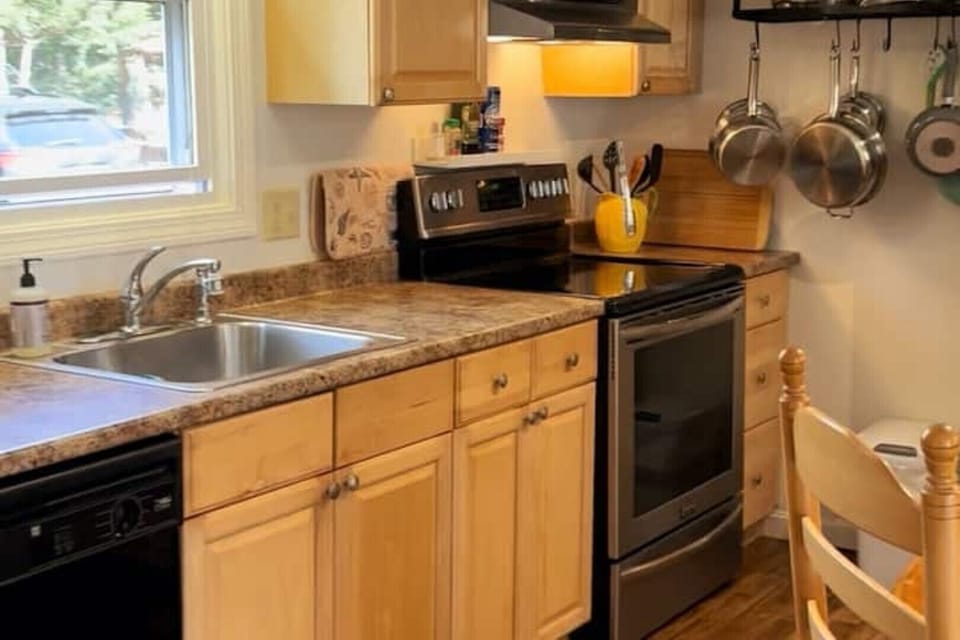 well stocked kitchen with plenty of pots & pans