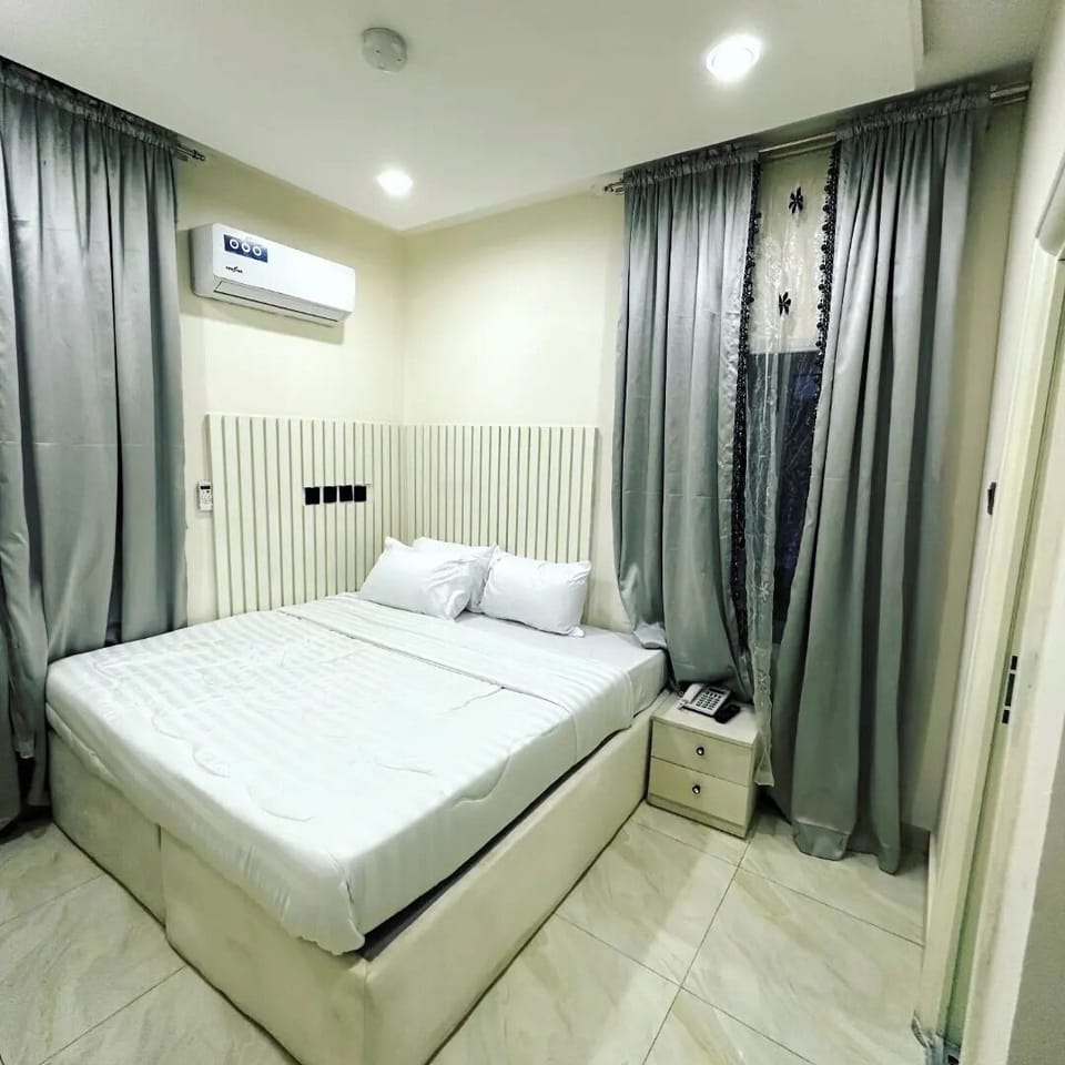 Luxury Apartment, Balcony, City View | Desk, laptop workspace, blackout drapes, soundproofing