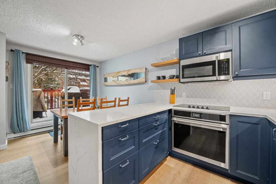 Full kitchen with a drip coffee machine, electric kettle, crockpot/slow cooker and a dedicated wine fridge.