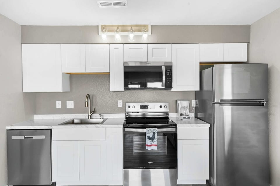 Condo, 1 King Bed with Sofa bed, Patio (Waterview Oasis) | Private kitchen | Coffee/tea maker, fridge, microwave, oven