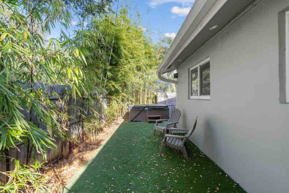Private backyard with hot tub. Direct access from kitchen.