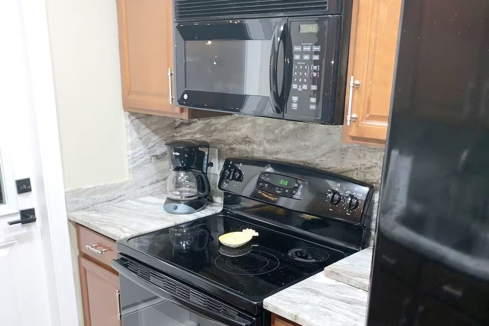 Range with stovetop and oven, coffee maker and microwave