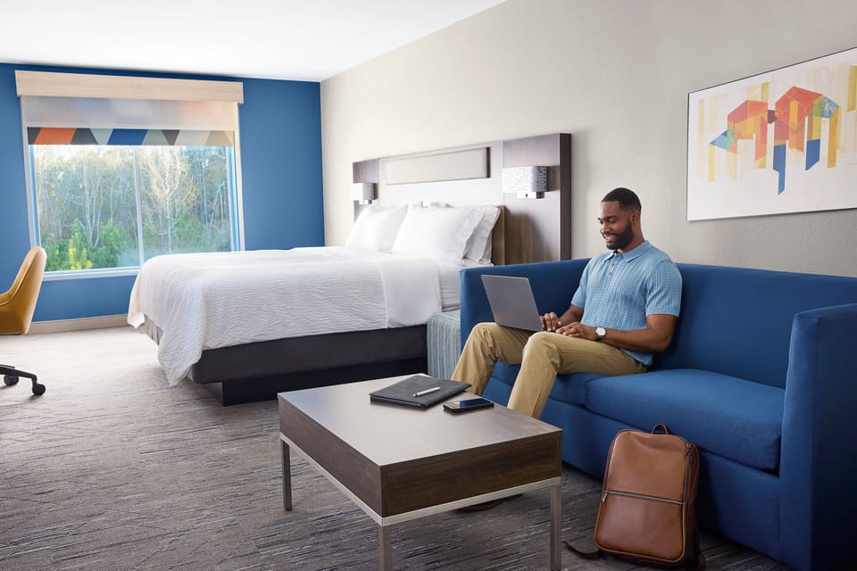 Suite, 1 King Bed | In-room safe, blackout drapes, iron/ironing board, free WiFi
