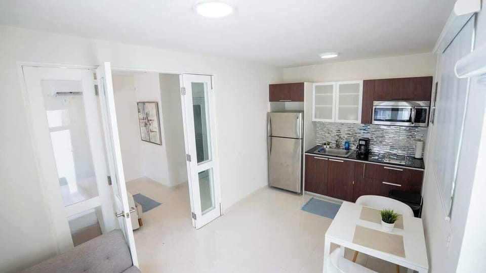 Bright interiors connect the living area with the kitchen for added convenience.